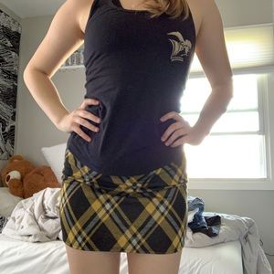 A yellow and black plaid skirt with a zipper.